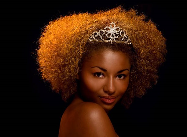 Beautiful woman of African ethnicity wearing a tiara.